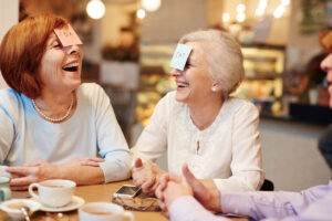 Older woman playing humorous game-Benefits of Play for Seniors